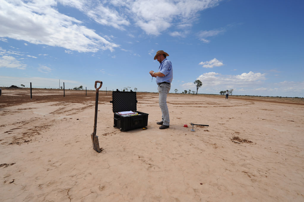 Ray taking a soil sample on a scald 