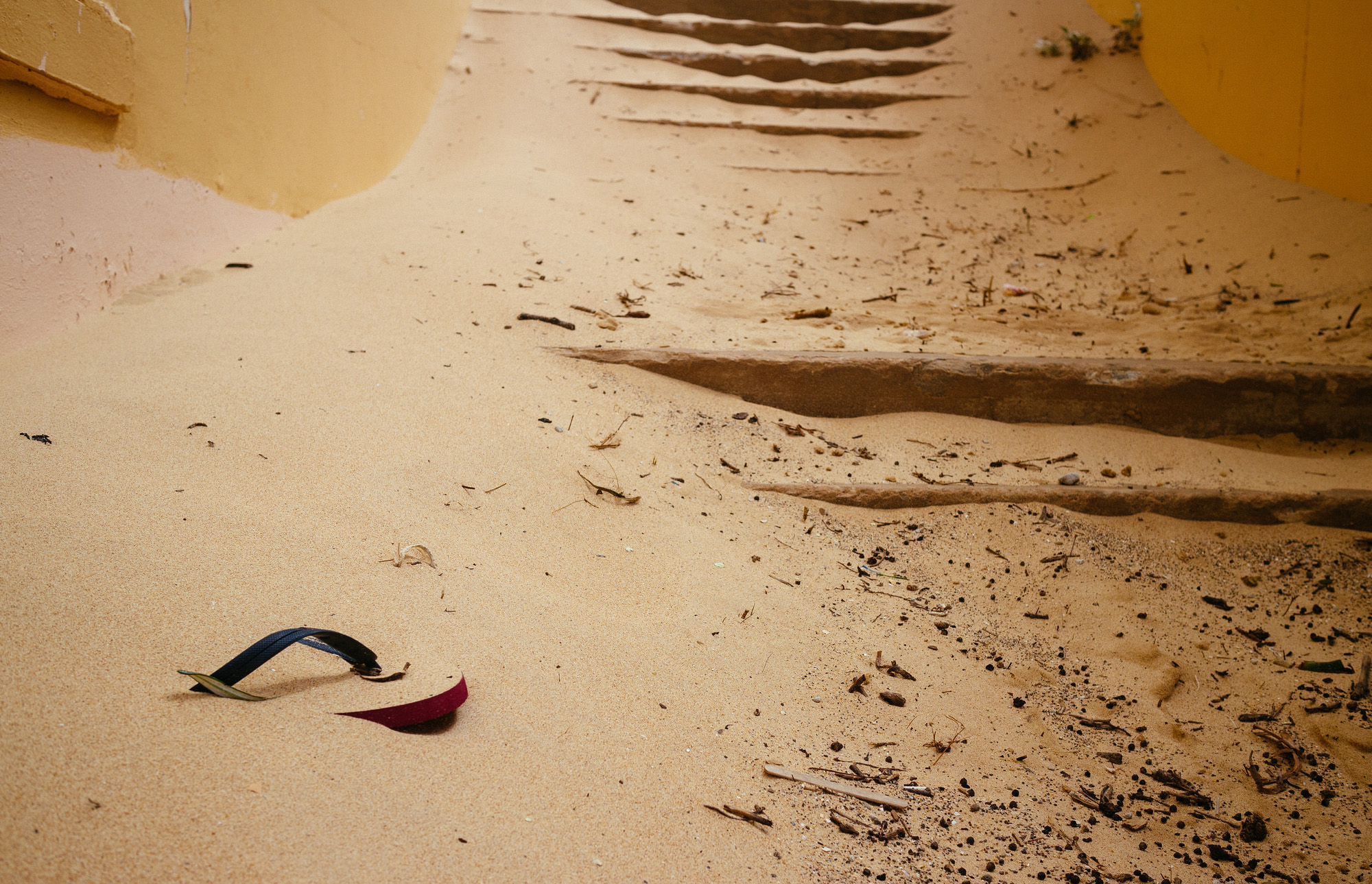 Thongs buried in sand